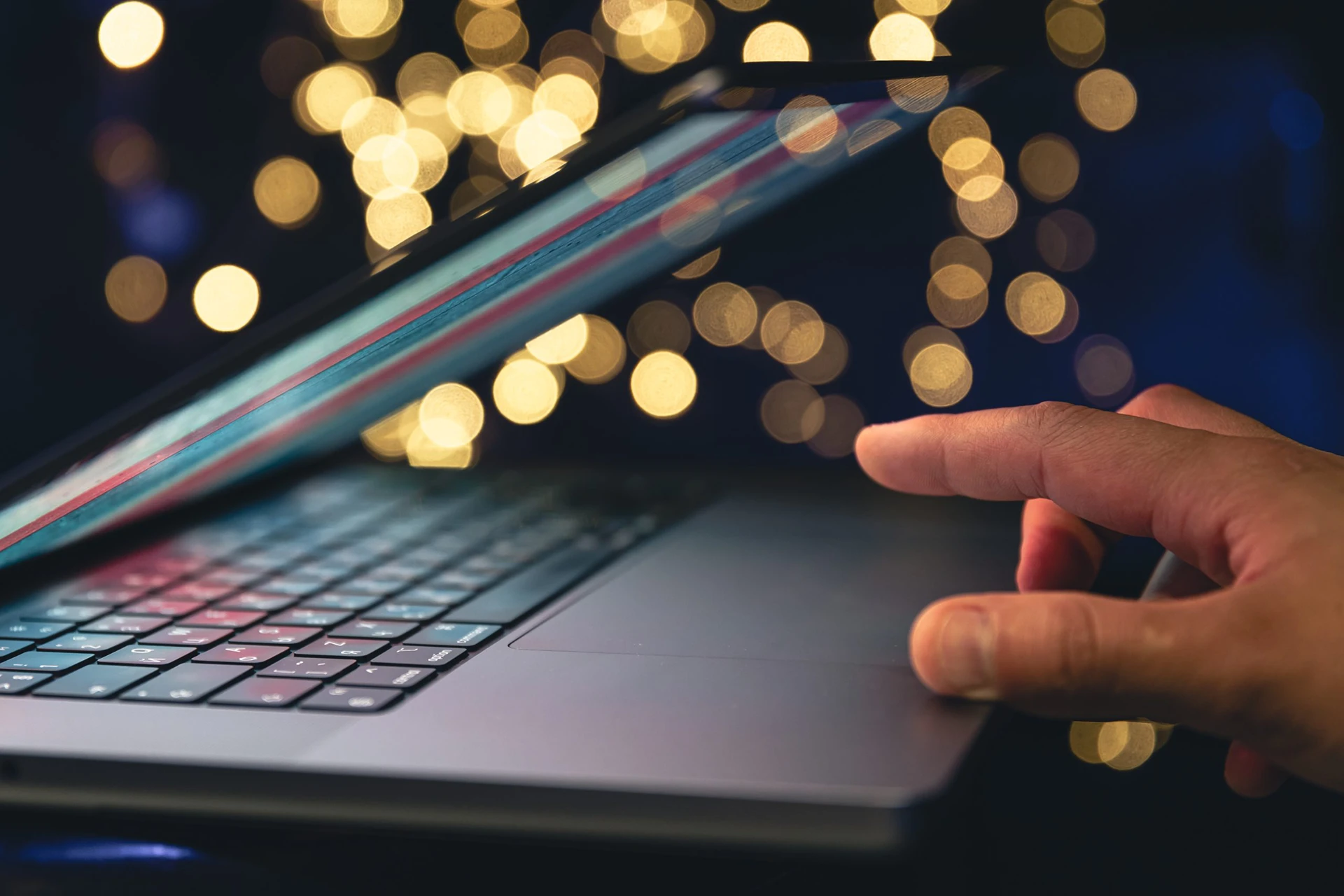 closeup-laptop-dark-background-with-bokeh-1-scaled